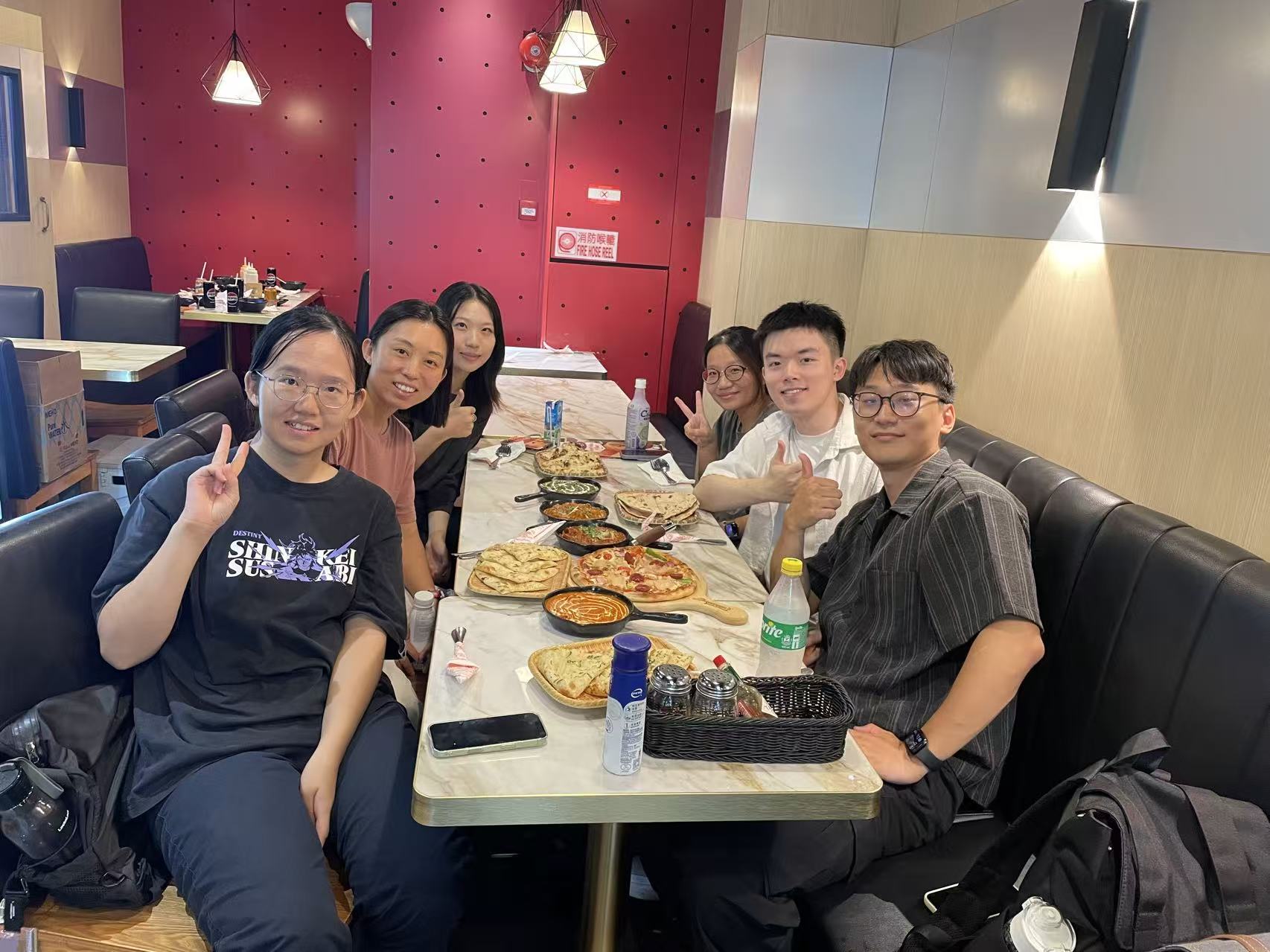 LINC Lab members sharing their first dinner gathering at Ebeneezer's in Hong Kong
